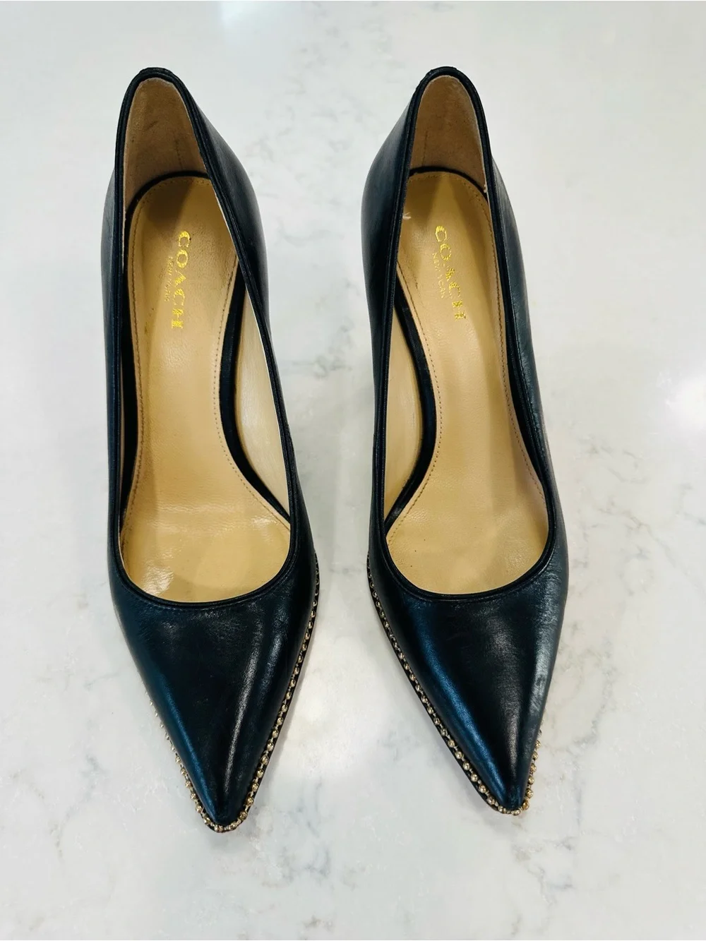Coach Tamera Black Leather Pointed Toe Pumps with Gold Beaded Accent